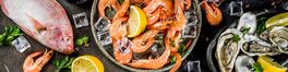 Fresh raw seafood squid shrimp oyster mussels fish with spices of herbs lemon on dark rusty ..Von ricka_kinamoto