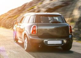 rental car in spain mountain landscape road at sunset | Von AA+W