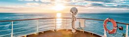 Summer cruise vacation concept. Panoramic view of the sea with a beautiful sunset just above the horizon. | Von Nancy Pauwels
